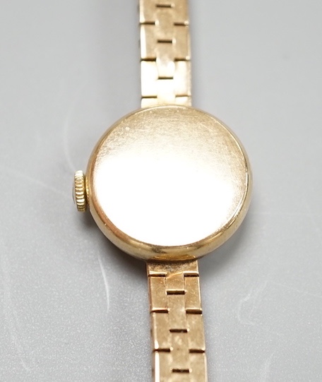 A lady's 9ct gold Tudor Royal manual wind wrist watch, on a 9ct gold bracelet with Rolex crown insignia on clasp, case diameter 18mm, gross weight 16.7 grams, no box or papers.